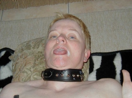 Older lady with short hair Tiffany Pearl wears a slave collar during kinky sex