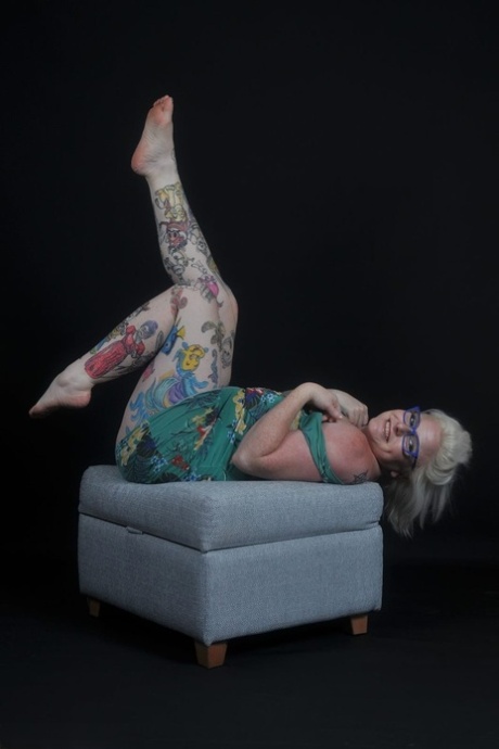 Tattooed blonde Mollie Foxxx gets naked in heels during a solo engagement