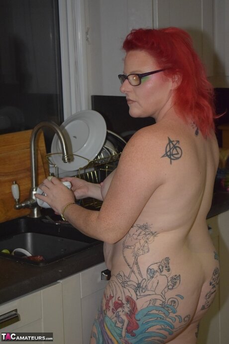 Tattooed British lady Mollie Foxxx does her housework in the nude