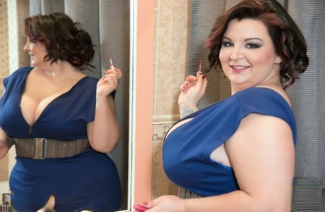 BBW Lucy Lenore unleashes her big boobs in the bathroom after doing her makeup