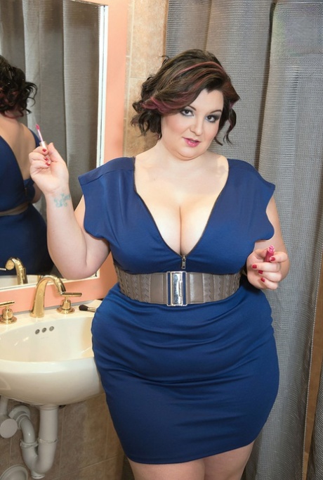 BBW Lucy Lenore unleashes her big boobs in the bathroom after doing her makeup