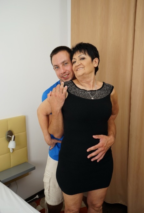 Older woman is relieved of her dress and pretties during foreplay with a boy