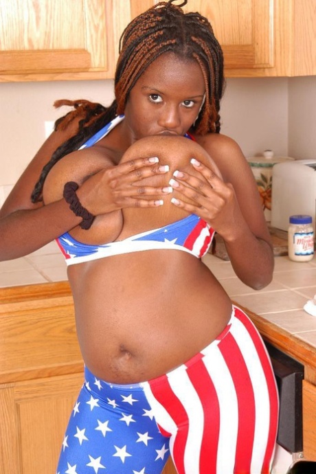 Curvy ebony mom Diva lets huge black tits loose from bikini top