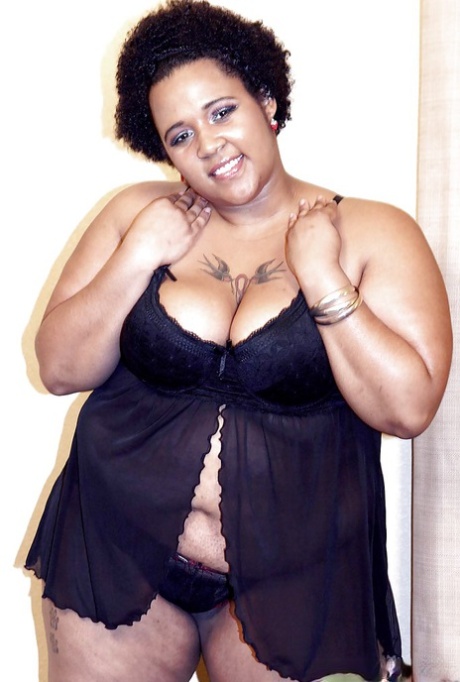 Black fatty Kitten removes lingerie to expose her big fat ass
