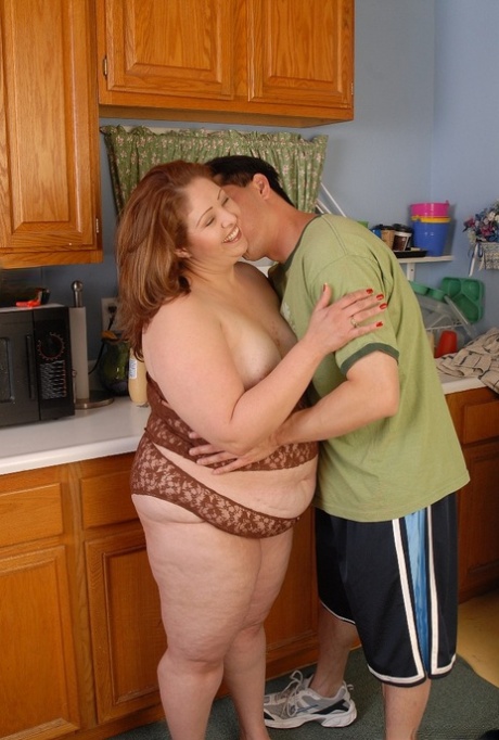 Overweight housewife Cyn eating cumshot out of hand in kitchen