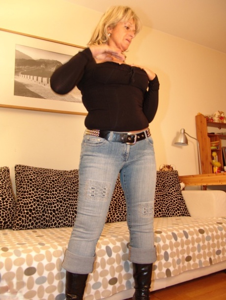 Mature blonde Kristina shows her tits and rubs her twat before getting peed on