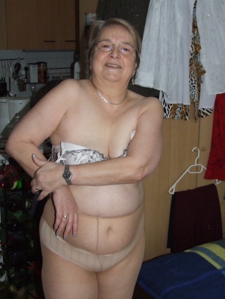 Fat European granny Sybille stripping off her clothes and skin tone tights