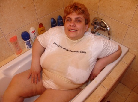 Mature BBW Nadia gets fisted, fucked and pissed on by her young boy toy