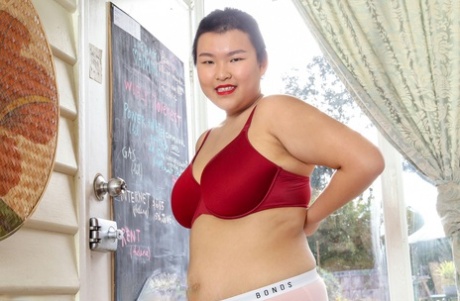 Asian amateur strips naked to show her chubby nude body & her hairy twat