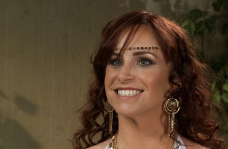Redheaded MILF Bella Rossi undresses and gets rammed in an IR gangbang