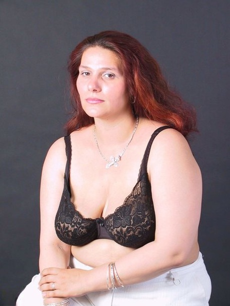 Fat mature babe Eda goes topless & covers her natural knockers with her hands