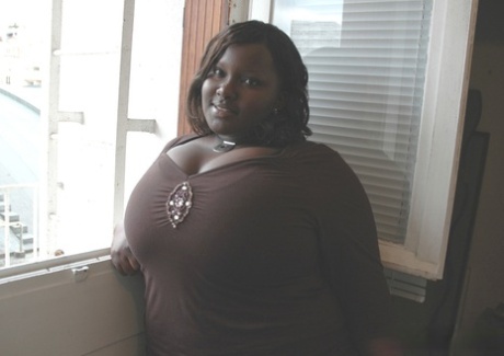 Amateur ebony Mariana Kodjo lets out her massive tits and shows them up close