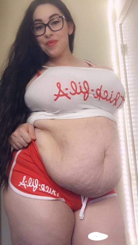 Tattooed fatty Jessie Minx showing off her hanging tits  her big tummy