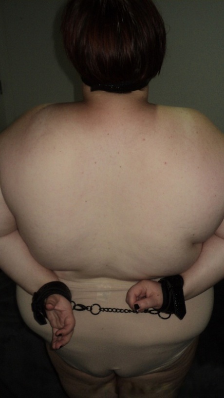 Fat submissive mature LaLa Delilah squeezes her big tits while cuffed