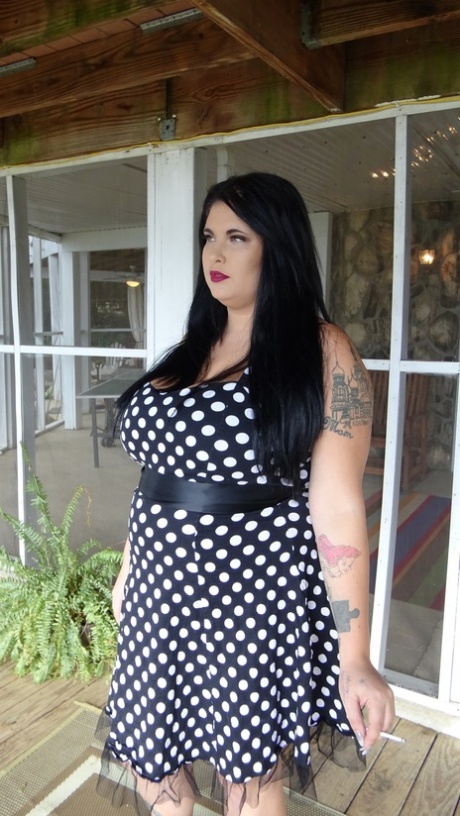 Dark haired chubby model Mischievous Kitty flashes her undies in a solo