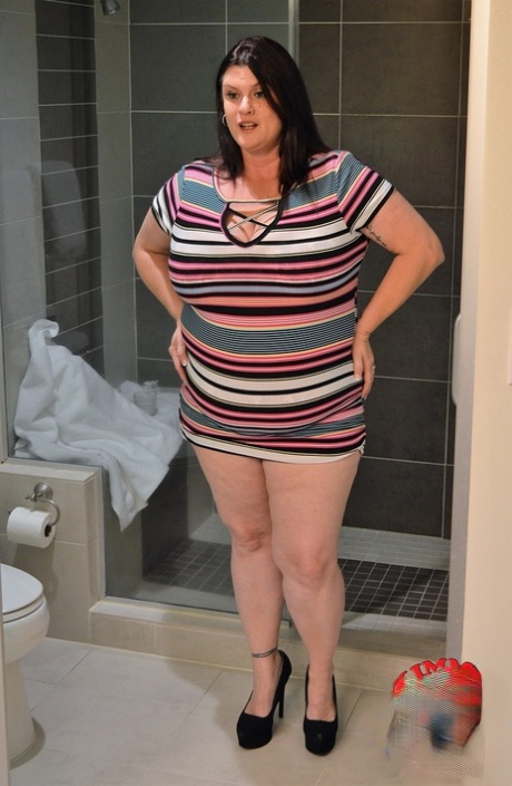 Gorgeous MILF fatty Kimmie Kaboom showering her big natural tits with milk