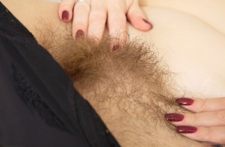 Chubby MILF Katrin Porto takes off her clothes & spreads her hairy pussy