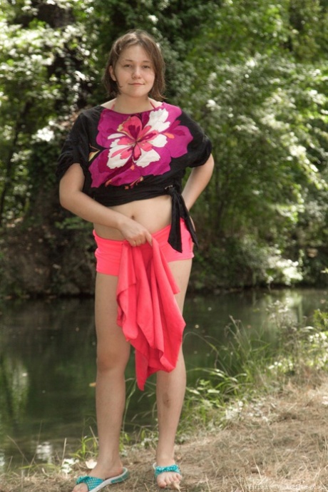 Brunette teen with tiny tits Clarissa exposes her hairy armpits in the woods