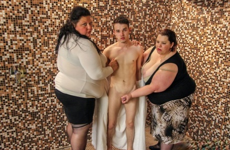 Fully clothed mature BBWs Heidi & Miranda play with a teenage boy's dick