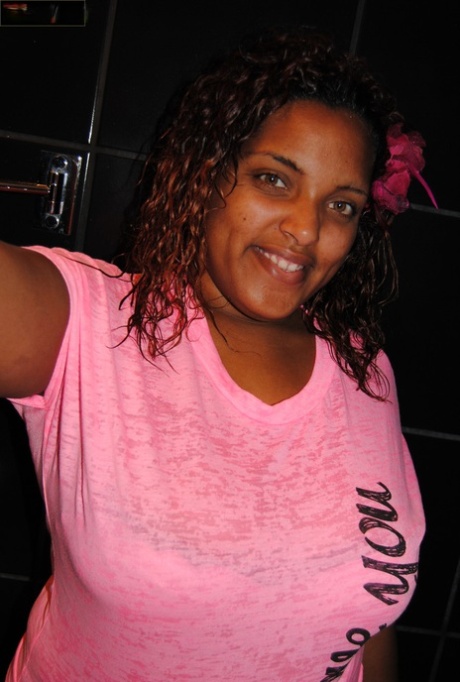 Ebony BBW stripping in a solo and showing her huge ass and tits