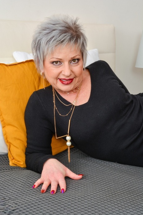 Short-haired GILF Lady X strips to her underwear & poses with her young lover