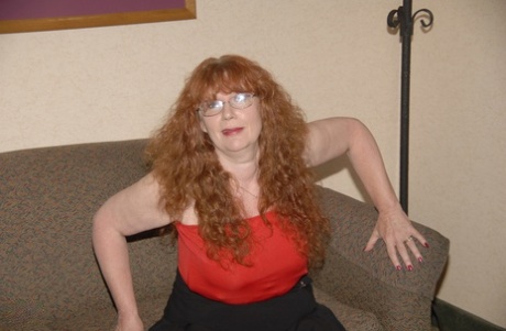 Curly-haired mature woman Sierra masturbates and gives a nice BJ