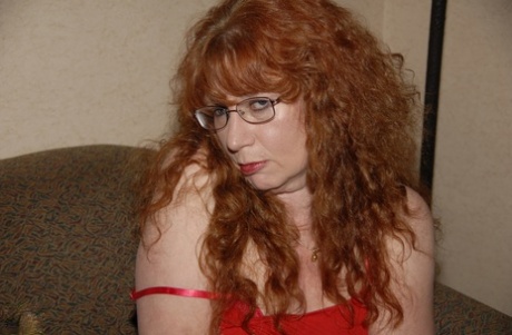 Curly-haired mature woman Sierra masturbates and gives a nice BJ