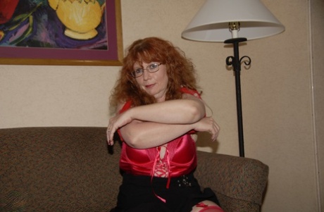 Curly-haired mature woman Sierra masturbates and gives a nice BJ