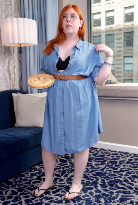 Chubby shemale with glasses Clara Belle plays with her nipples & rod in a solo