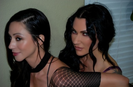 Sexy black-haired MILFs Jenevieve Hexxx and Ariella Ferrera suck a toy in POV