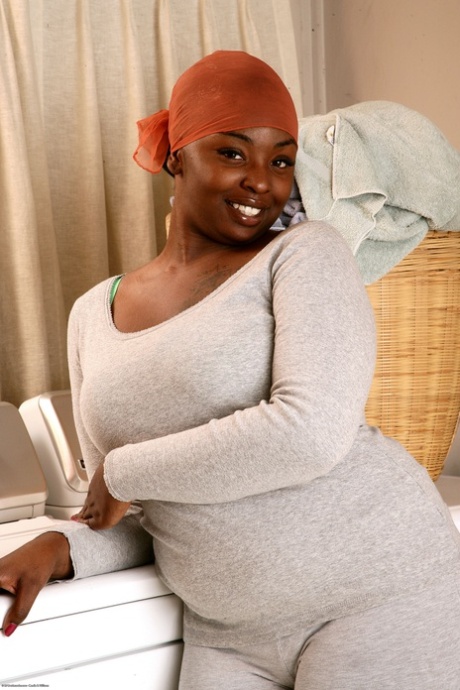 Chubby ebony Chocolate exposes her curvy body and spreads her twat