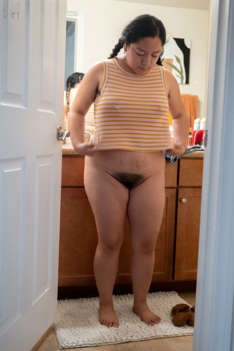 Chubby amateur Lola L shows her hairy pussy & her big ass while dressing