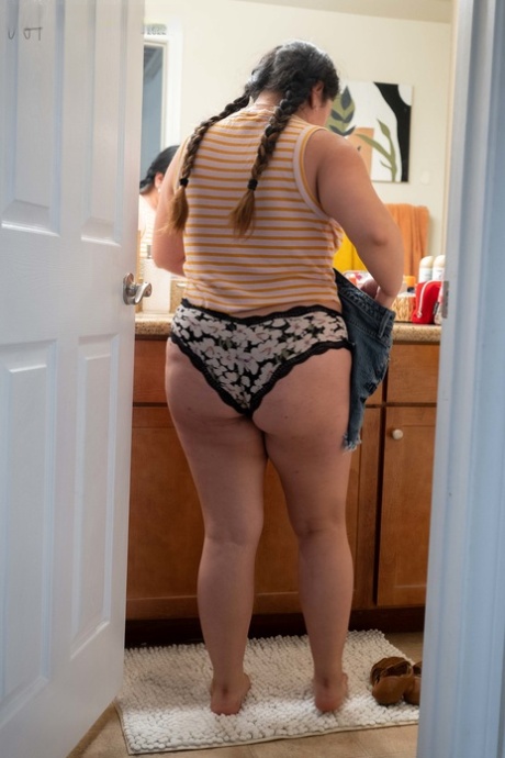 Chubby amateur Lola L shows her hairy pussy & her big ass while dressing