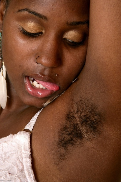 Horny ebony Lee exposes her hairy armpits and twat and big booty