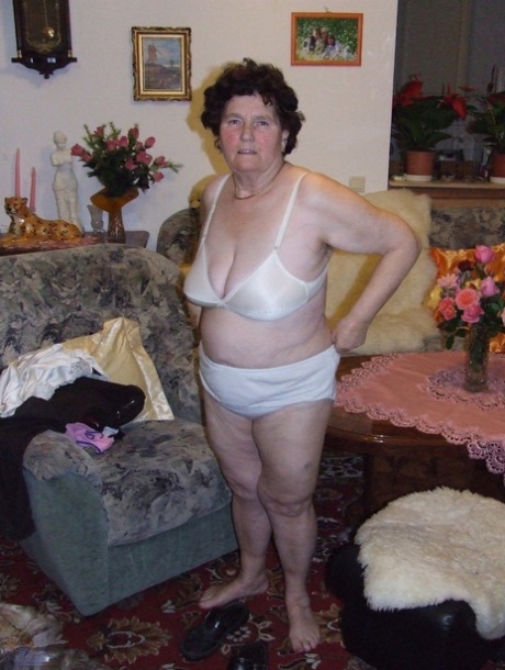 Mature fatty Hildegard strips and shows her huge tits and ass in a solo