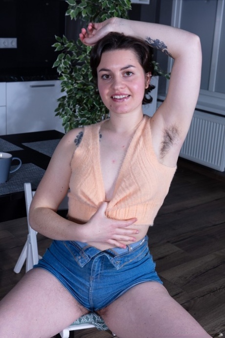 Hot amateur Maja Aguilar exposes her bushy armpits and twat in a solo