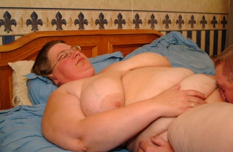 Fat granny in glasses Jo unveils her saggy breasts and gets her twat licked
