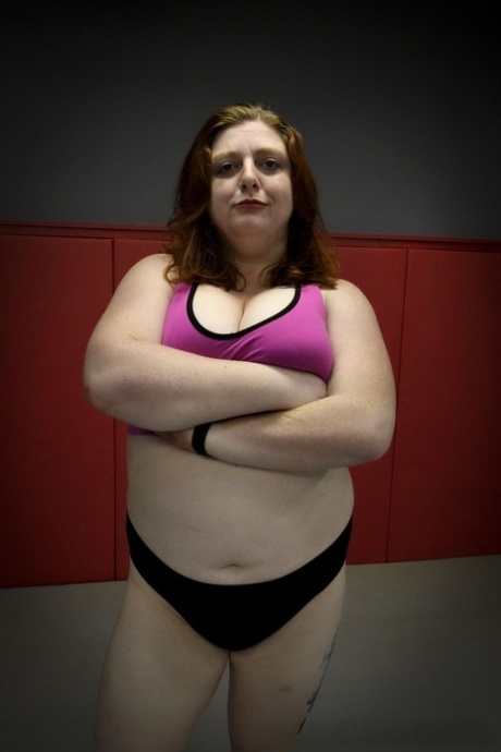 Chubby wrestler Betty Brickhouse dominates and pegs her sparring partner