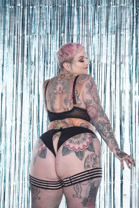Beautiful babe Galda Lou shows off her heavily tattooed chubby body