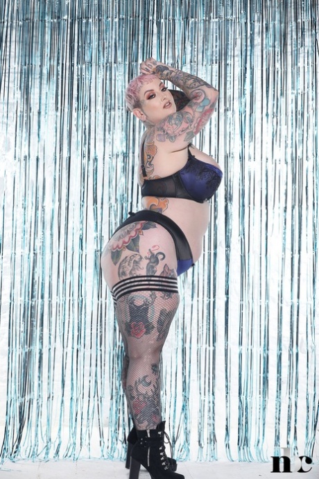 Beautiful babe Galda Lou shows off her heavily tattooed chubby body