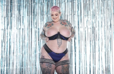 Beautiful babe Galda Lou shows off her heavily tattooed chubby body