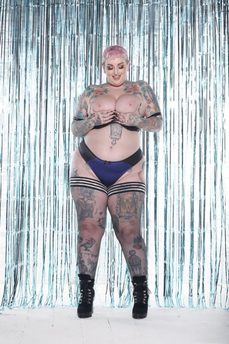 Beautiful babe Galda Lou shows off her heavily tattooed chubby body