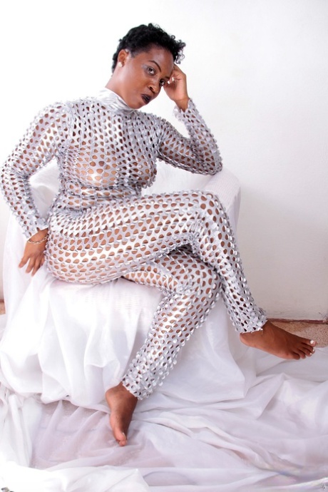 Thick Afro-American teen strips her sheer outfit & shows her ebony holes