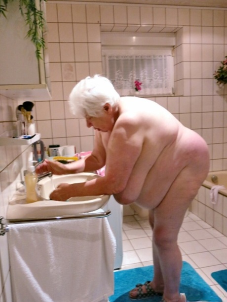 Playful granny Neebana strips and shows her monster saggy boobs