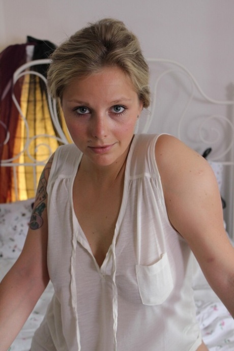 Tattooed amateur shows her big booty and plays with her shaved pussy