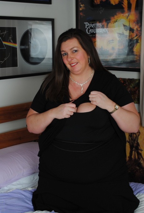 Horny fat mom with big tits Lucy undresses and toys her swollen vagina