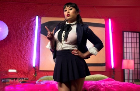 Beautiful schoolgirl Mia Li teasing with her big tits & juicy thighs