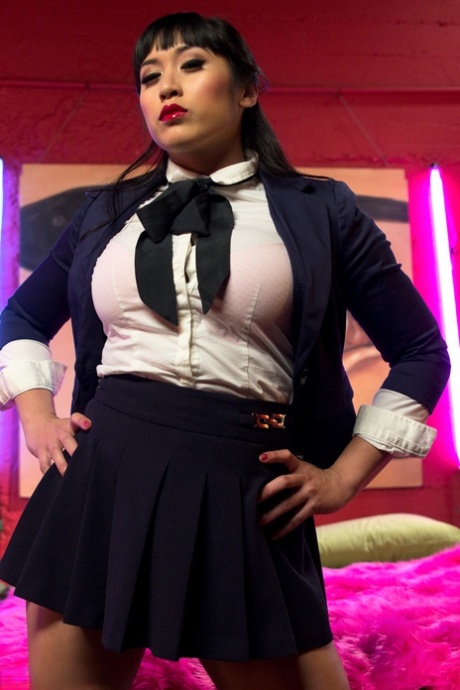 Beautiful schoolgirl Mia Li teasing with her big tits & juicy thighs
