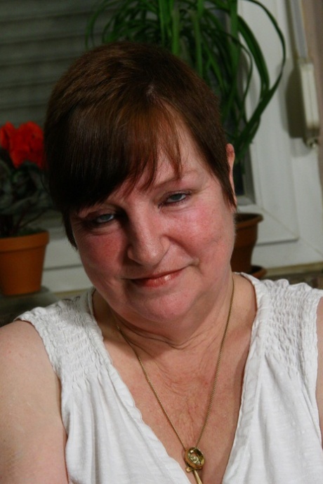 Short-haired granny Anita C reveals her fat body and toys her mature snatch